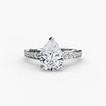 Solitaire with Pavé engagement ring in white gold with a pear-shaped centre stone