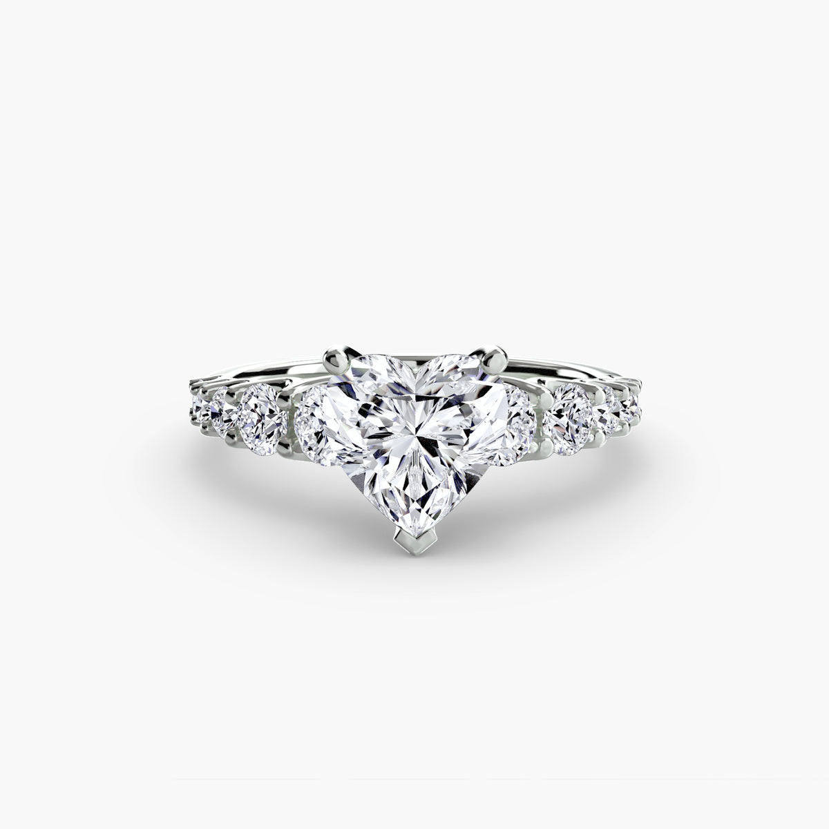 The Graduated Accent Ring in white gold with a heart-shaped centre stone