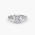 The Graduated Accent Ring in white gold with a heart-shaped centre stone