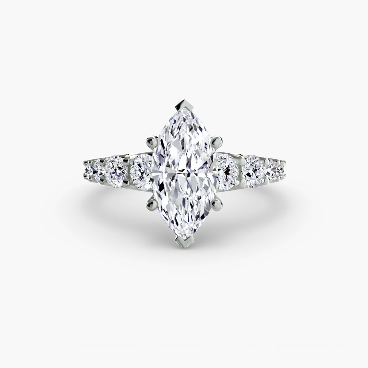 The Graduated Accent Ring in white gold with a marquise centre stone
