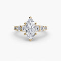 The Graduated Accent Ring in yellow gold with a marquise centre stone