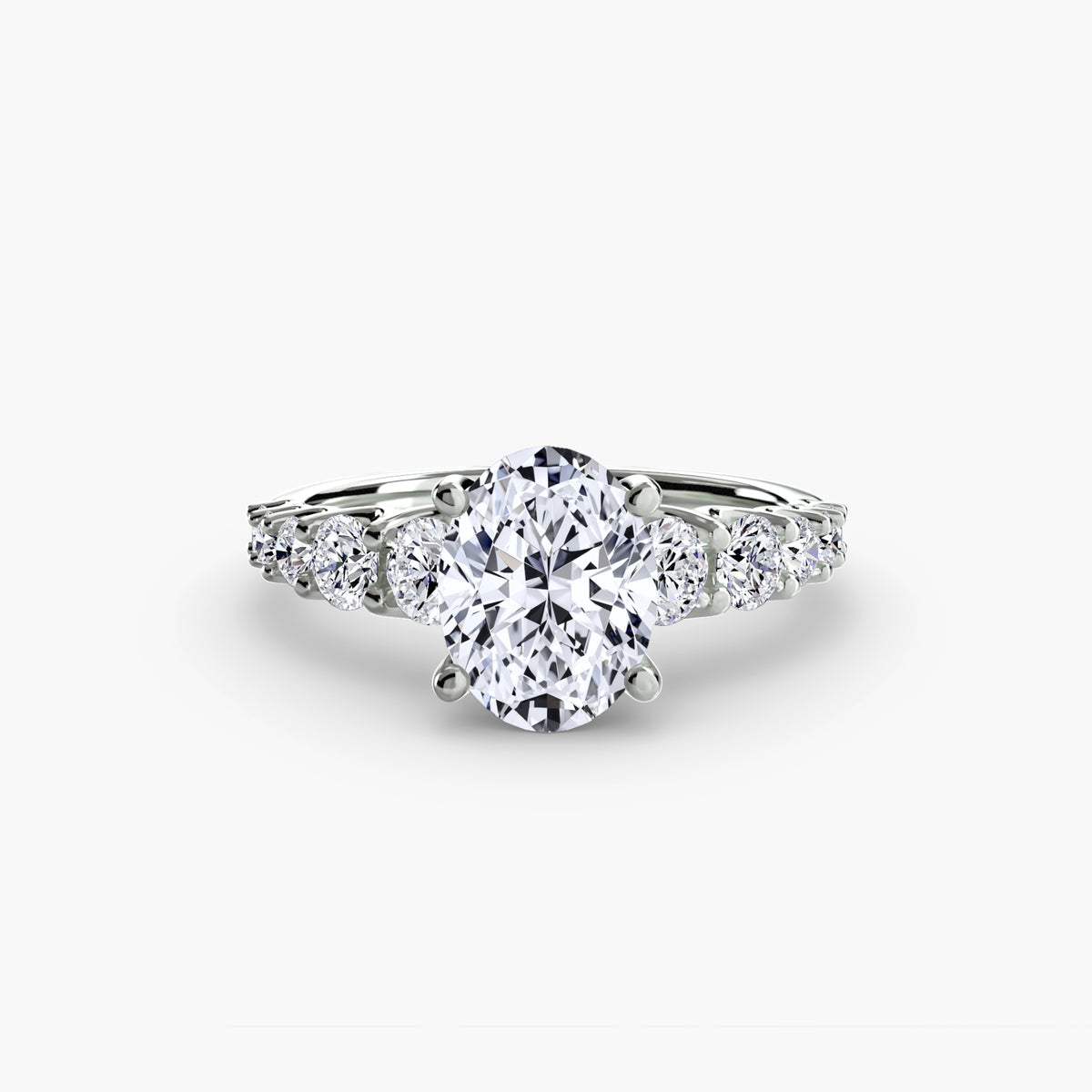 The Graduated Accent Ring in white gold with an oval centre stone