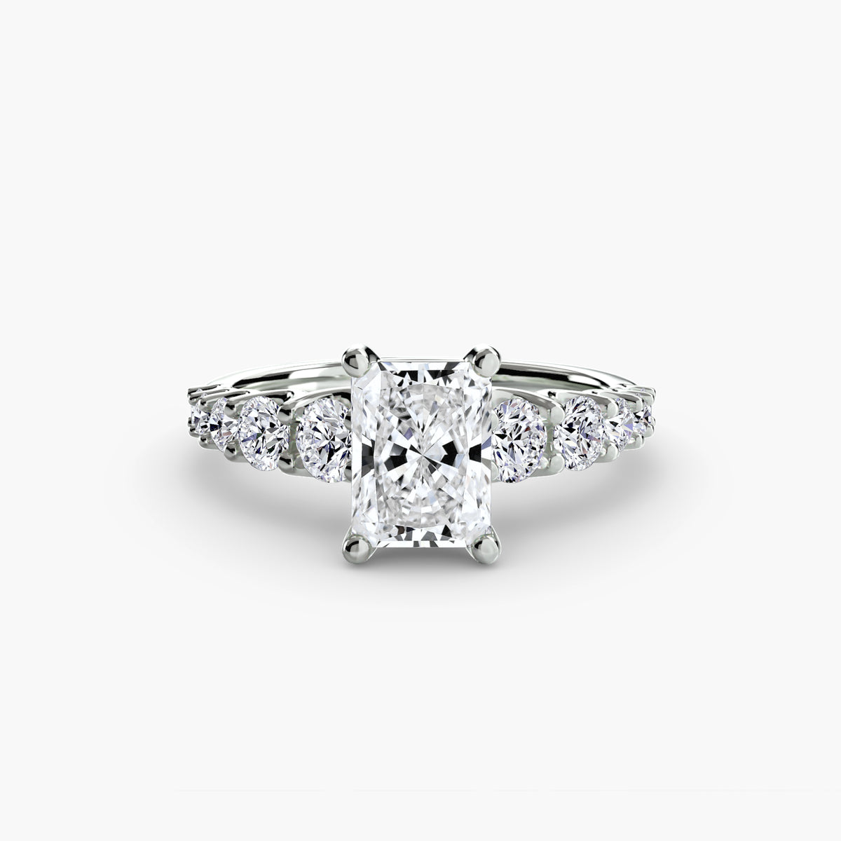 The Graduated Accent Ring in white gold with a radiant-cut centre stone