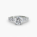 The Graduated Accent Ring in white gold with a round centre stone