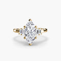 Baguette Accent Solitaire engagement ring in yellow gold with a marquise centre stone
