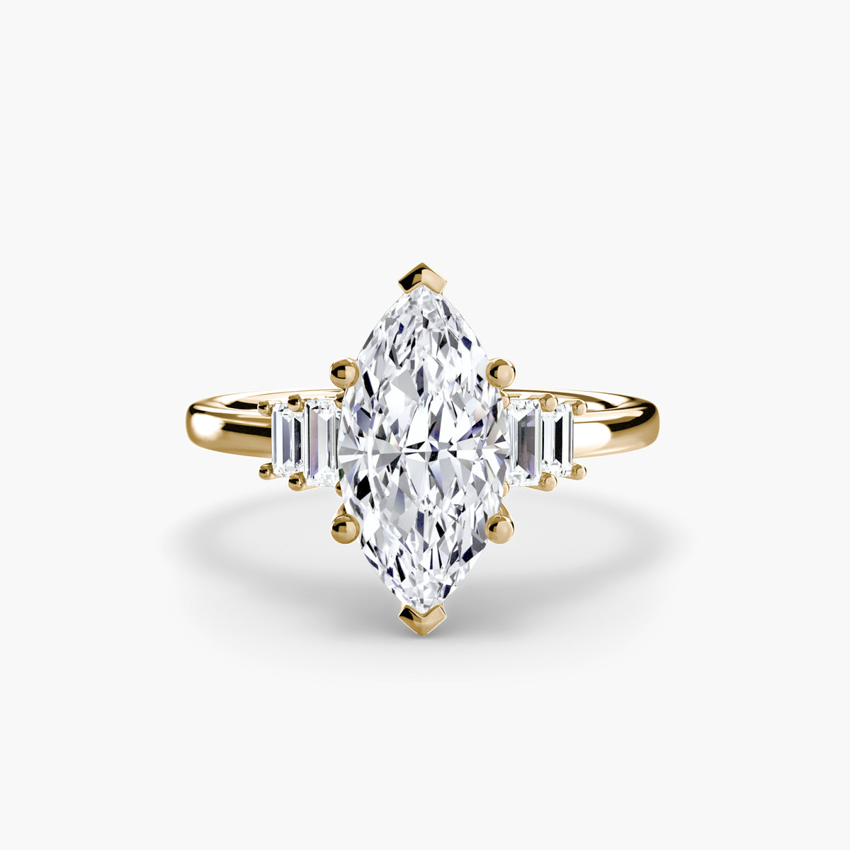 Baguette Accent Solitaire engagement ring in yellow gold with a marquise centre stone