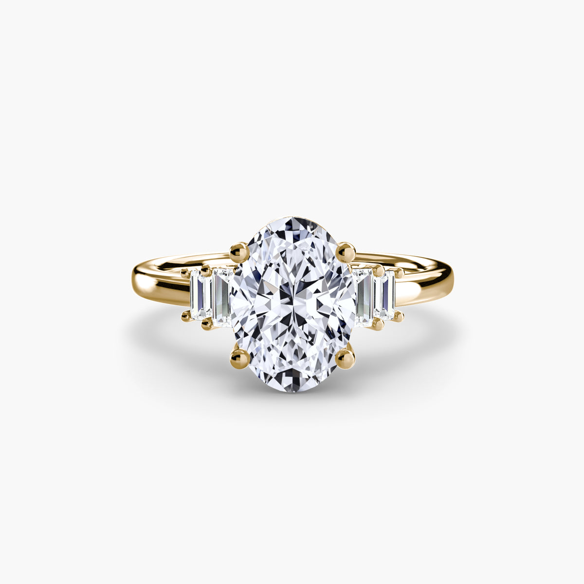 Baguette Accent Solitaire engagement ring in yellow gold with an oval centre stone