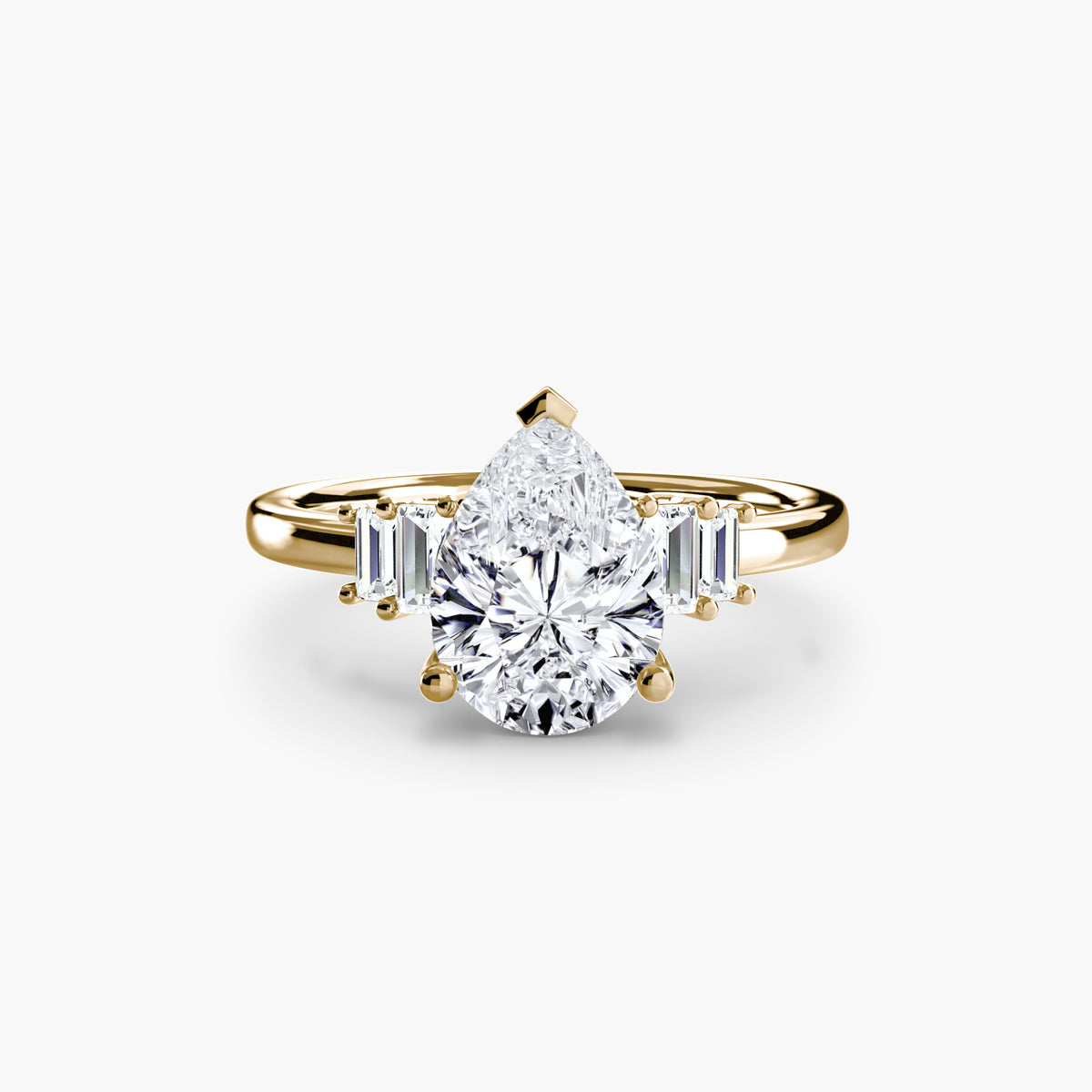 Baguette Accent Solitaire engagement ring in yellow gold with a pear-shaped centre stone