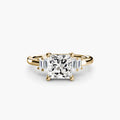 Baguette Accent Solitaire engagement ring in yellow gold with a princess-cut centre stone
