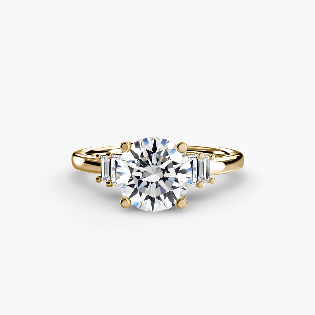 Baguette Accent Solitaire engagement ring in yellow gold with a round centre stone