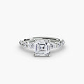 The Tiered Accent Ring in white gold with an Asscher-cut centre stone