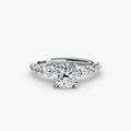 The Tiered Accent Ring in white gold with a cushion-cut centre stone