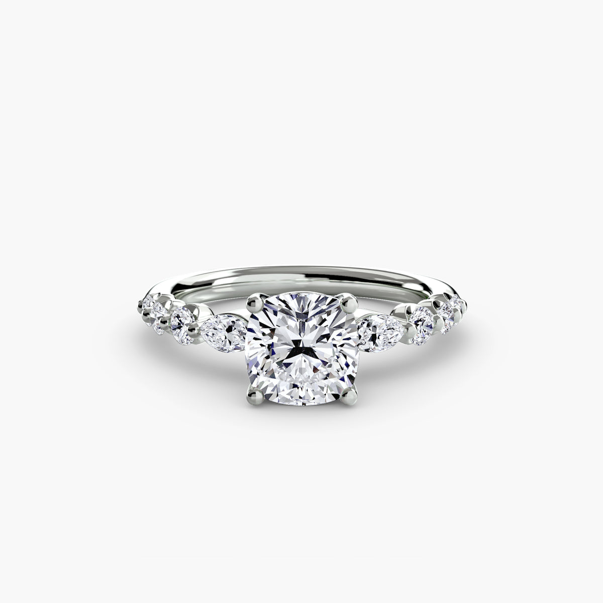 The Tiered Accent Ring in white gold with a cushion-cut centre stone