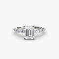 The Tiered Accent Ring in white gold with an emerald-cut centre stone