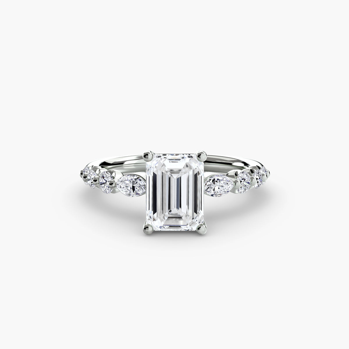 The Tiered Accent Ring in white gold with an emerald-cut centre stone