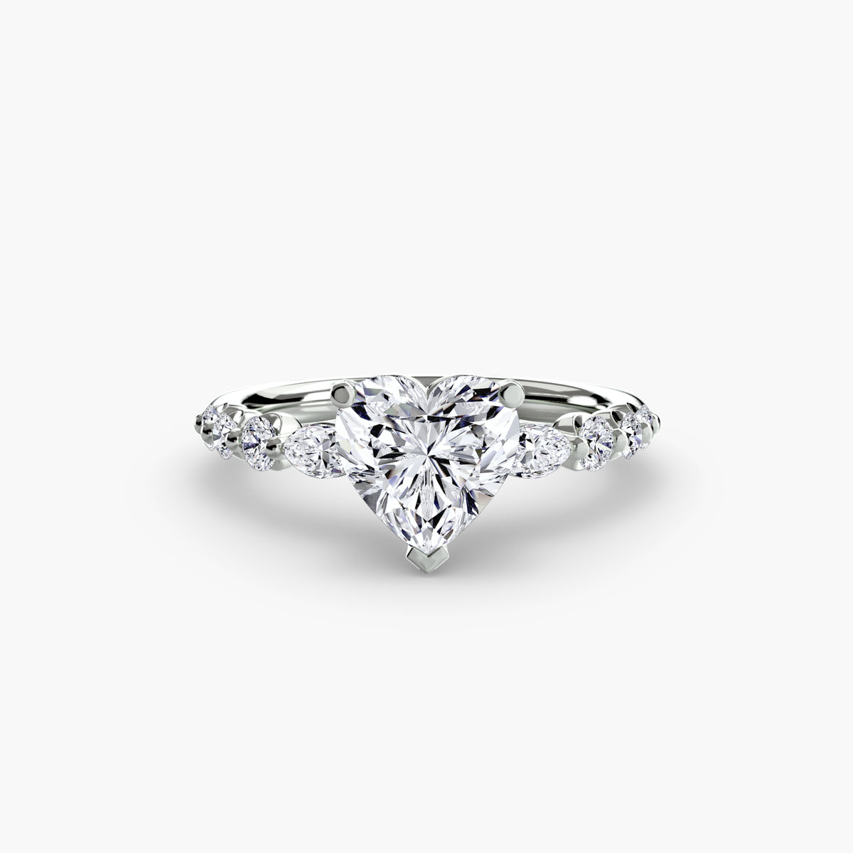 The Tiered Accent Ring in white gold with a heart-shaped centre stone