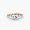 The Tiered Accent Ring in yellow gold with a heart-shaped centre stone