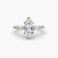 The Tiered Accent Ring in yellow gold with a marquise centre stone