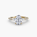The Tiered Accent Ring in yellow gold with an oval centre stone