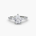 The Tiered Accent Ring in white gold with a pear-shaped centre stone