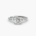 The Tiered Accent Ring in white gold with a princess-cut centre stone