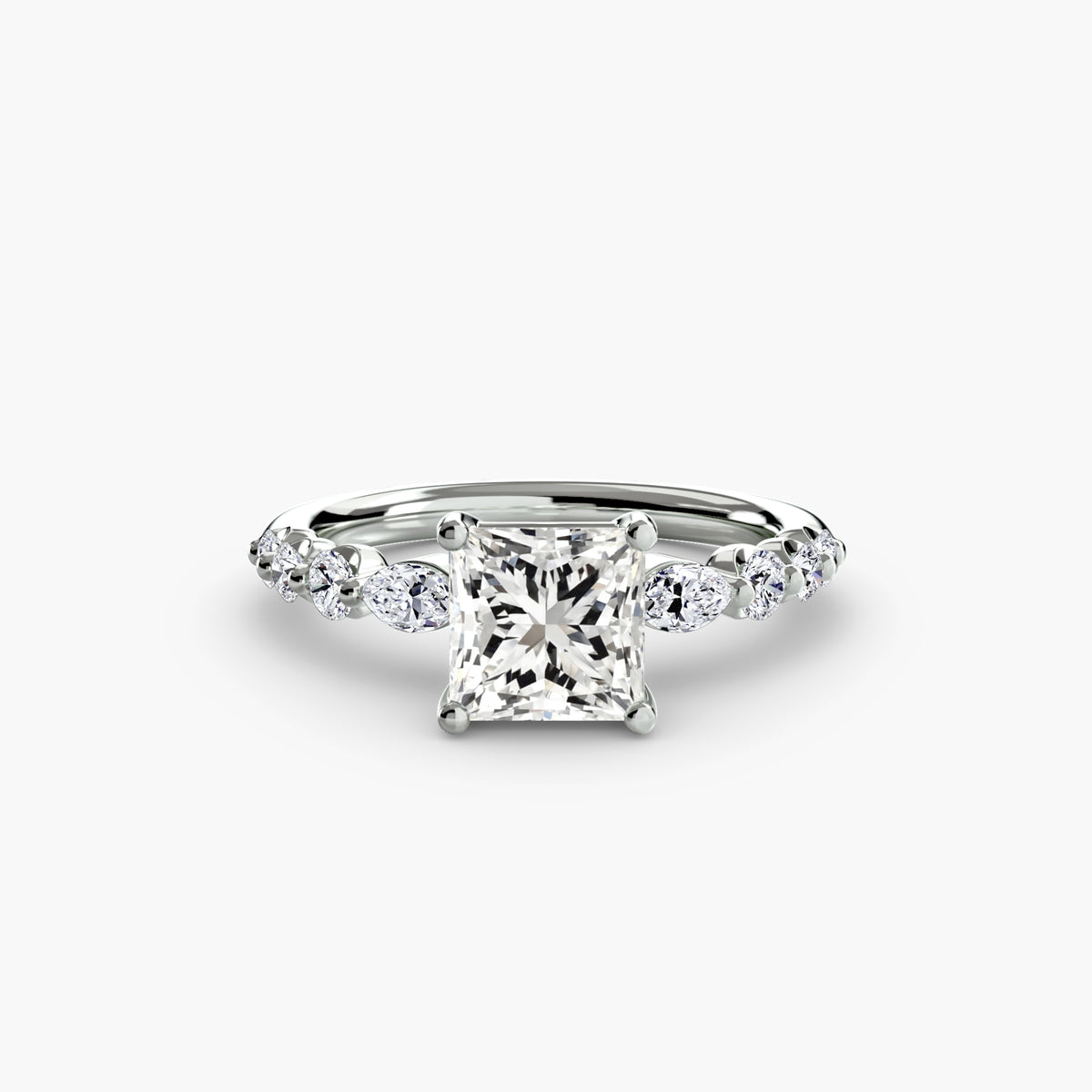 The Tiered Accent Ring in white gold with a princess-cut centre stone
