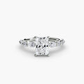 The Tiered Accent Ring in white gold with a radiant-cut centre stone