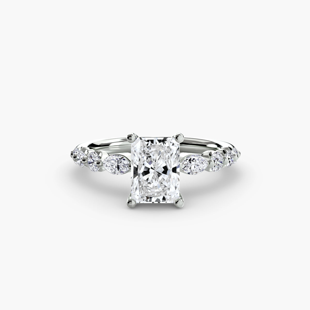 The Tiered Accent Ring in white gold with a radiant-cut centre stone