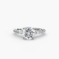 The Tiered Accent Ring in white gold with a round centre stone