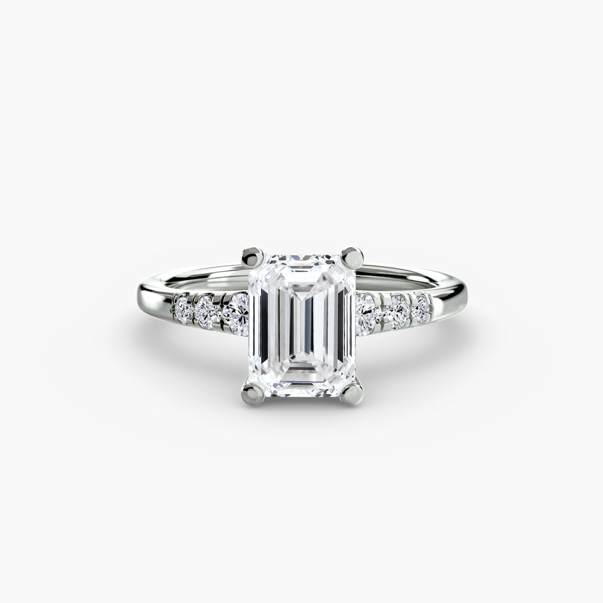 Solitaire with Shoulder Accents engagement ring in white gold with an emerald-cut centre stone