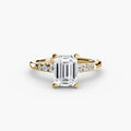 Solitaire with Shoulder Accents engagement ring in yellow gold with an emerald-cut centre stone