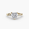 Solitaire with Shoulder Accents engagement ring in yellow gold with a heart-shaped centre stone