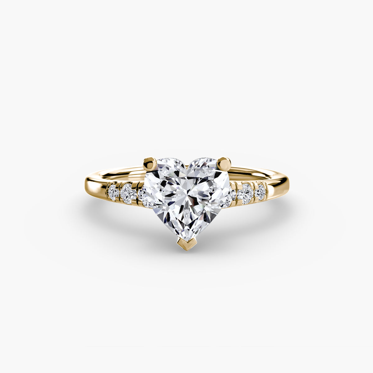 Solitaire with Shoulder Accents engagement ring in yellow gold with a heart-shaped centre stone