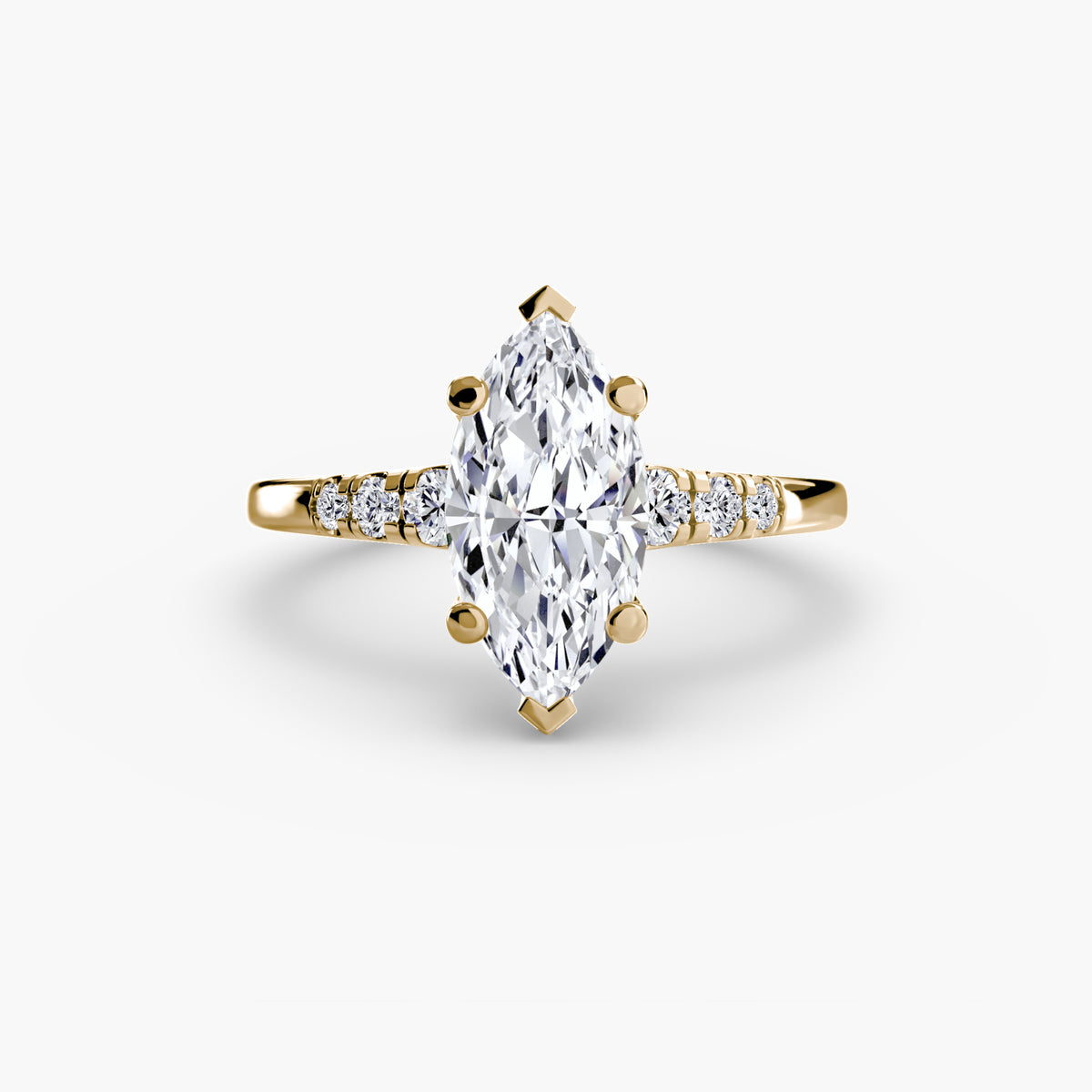 Solitaire with Shoulder Accents engagement ring in yellow gold with a marquise centre stone