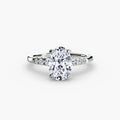Solitaire with Shoulder Accents engagement ring in white gold with an oval centre stone