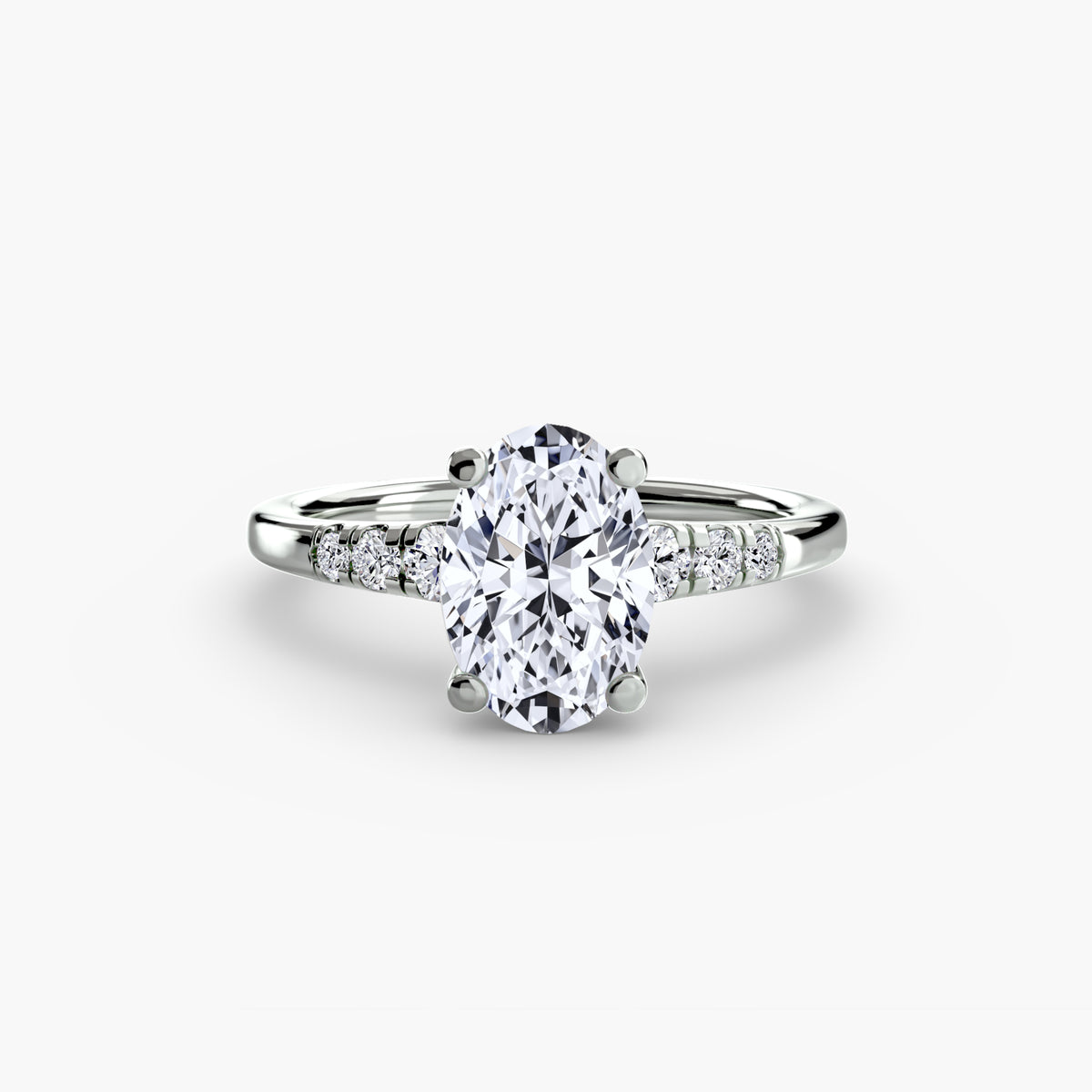 Solitaire with Shoulder Accents engagement ring in white gold with an oval centre stone