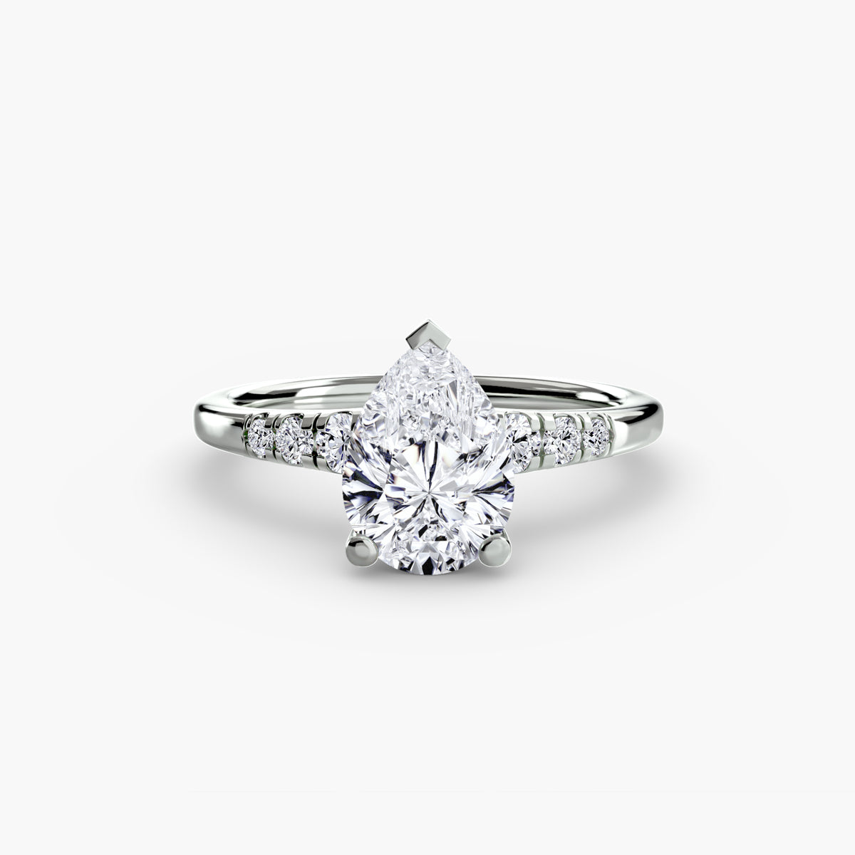 Solitaire with Shoulder Accents engagement ring in white gold with a pear-shaped centre stone