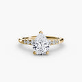 Solitaire with Shoulder Accents engagement ring in yellow gold with a pear-shaped centre stone