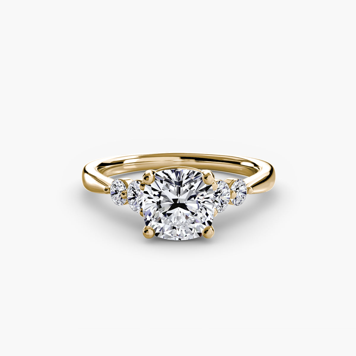 Solitaire with Shoulder Accents engagement ring in yellow gold with a cushion-cut centre stone