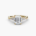 Solitaire with Shoulder Accents engagement ring in yellow gold with an emerald-cut centre stone