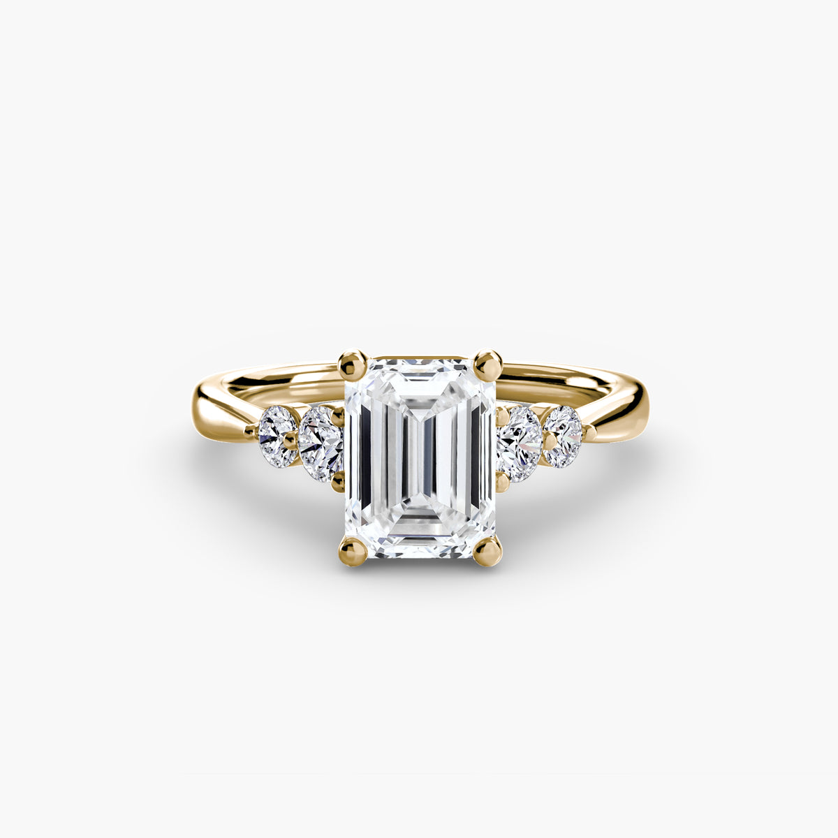 Solitaire with Shoulder Accents engagement ring in yellow gold with an emerald-cut centre stone