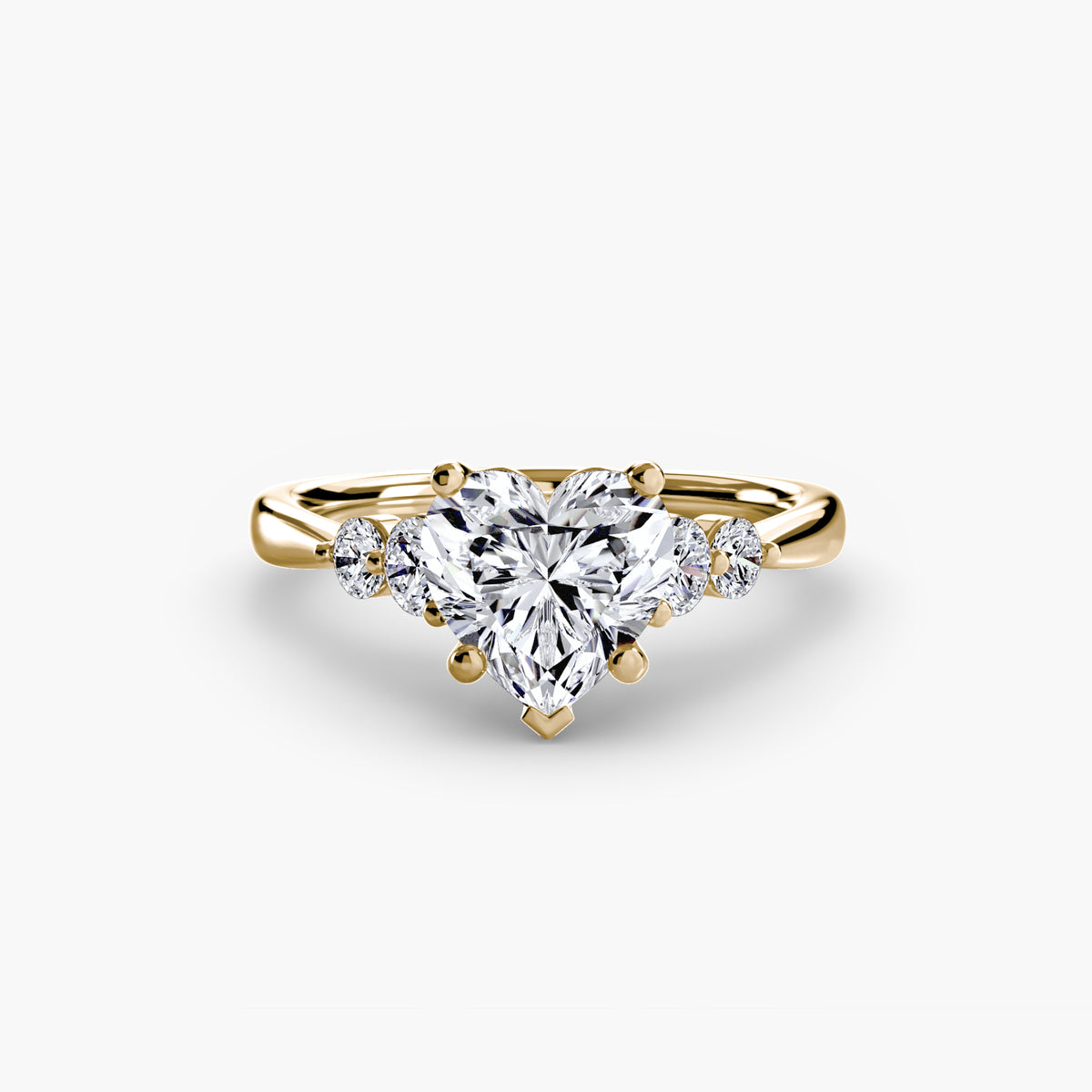 Solitaire with Shoulder Accents engagement ring in yellow gold with a heart-shaped centre stone