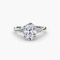Solitaire with Shoulder Accents engagement ring in white gold with an oval centre stone