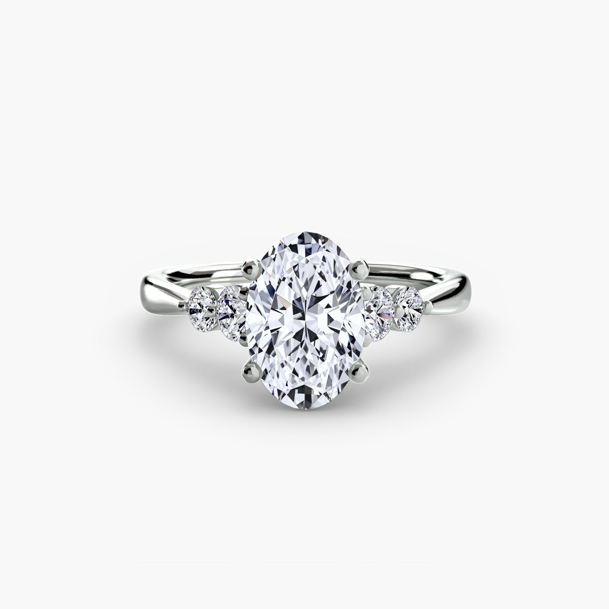 Solitaire with Shoulder Accents engagement ring in white gold with an oval centre stone