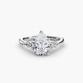 Solitaire with Shoulder Accents engagement ring in white gold with a pear-shaped centre stone