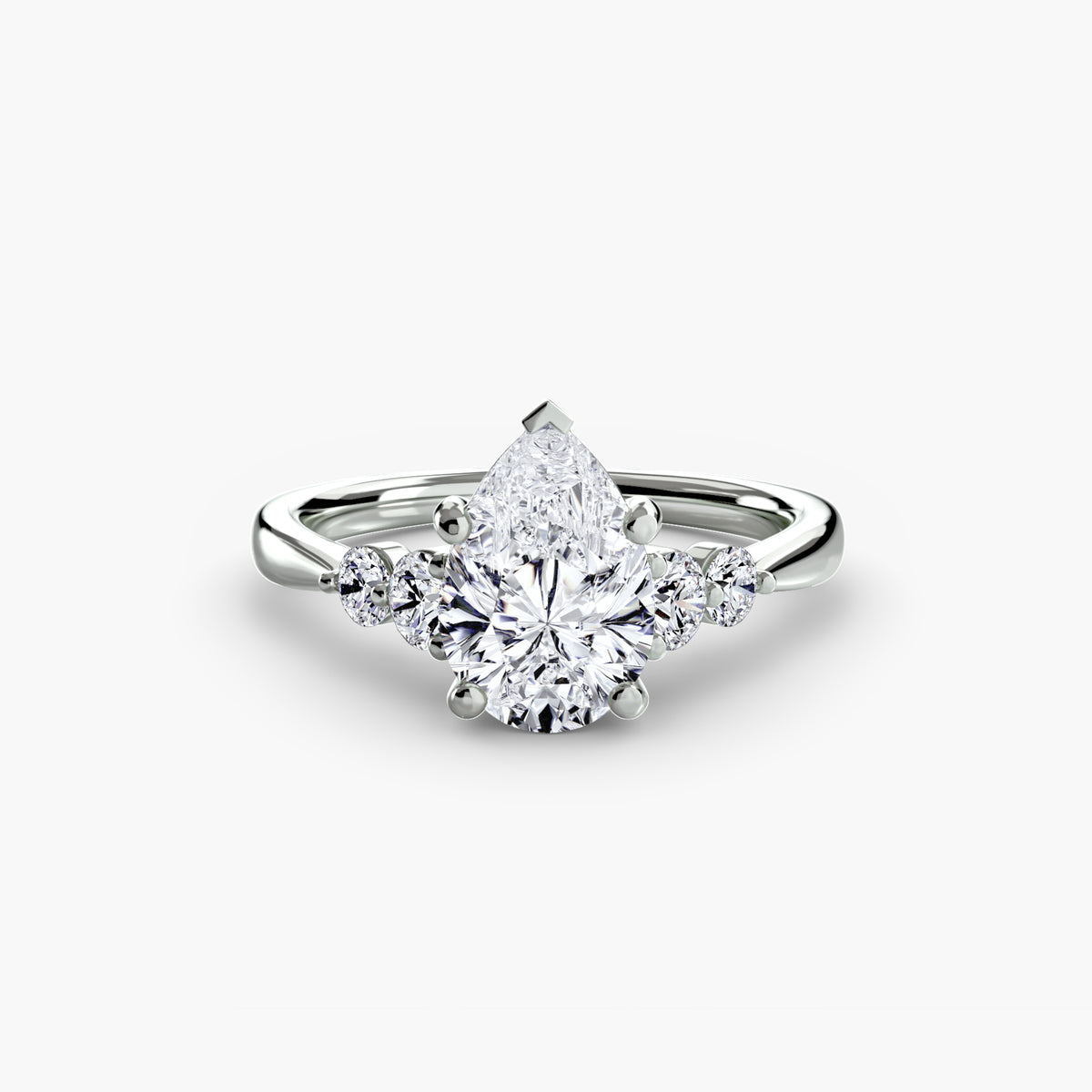 Solitaire with Shoulder Accents engagement ring in white gold with a pear-shaped centre stone