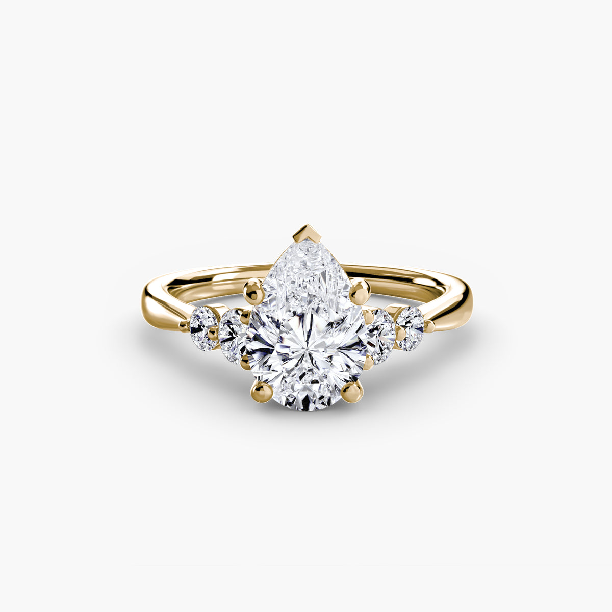 Solitaire with Shoulder Accents engagement ring in yellow gold with a pear-shaped centre stone
