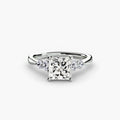 Solitaire with Shoulder Accents engagement ring in white gold with a princess-cut centre stone