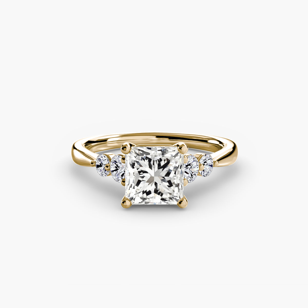 Solitaire with Shoulder Accents engagement ring in yellow gold with a princess-cut centre stone
