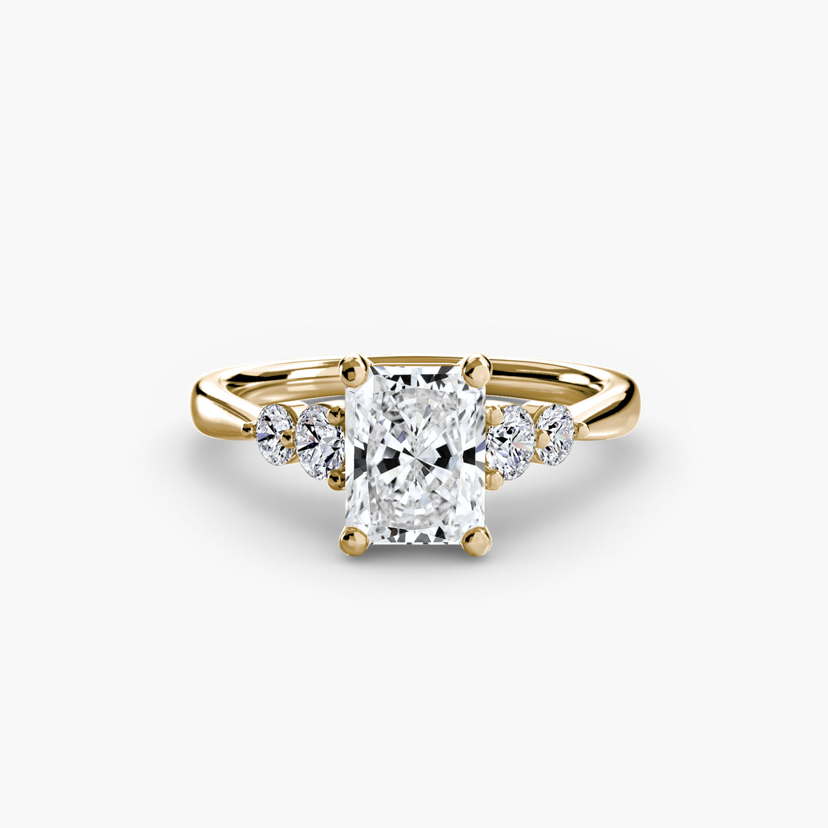 Solitaire with Shoulder Accents engagement ring in yellow gold with a radiant-cut centre stone